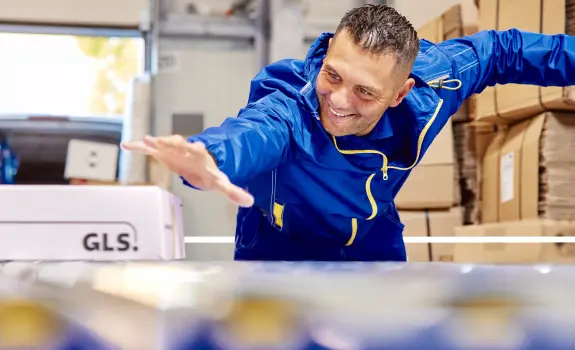 Happy man grabs a package