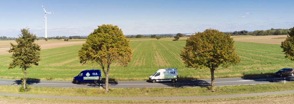 GLS vans in Dutch landscape